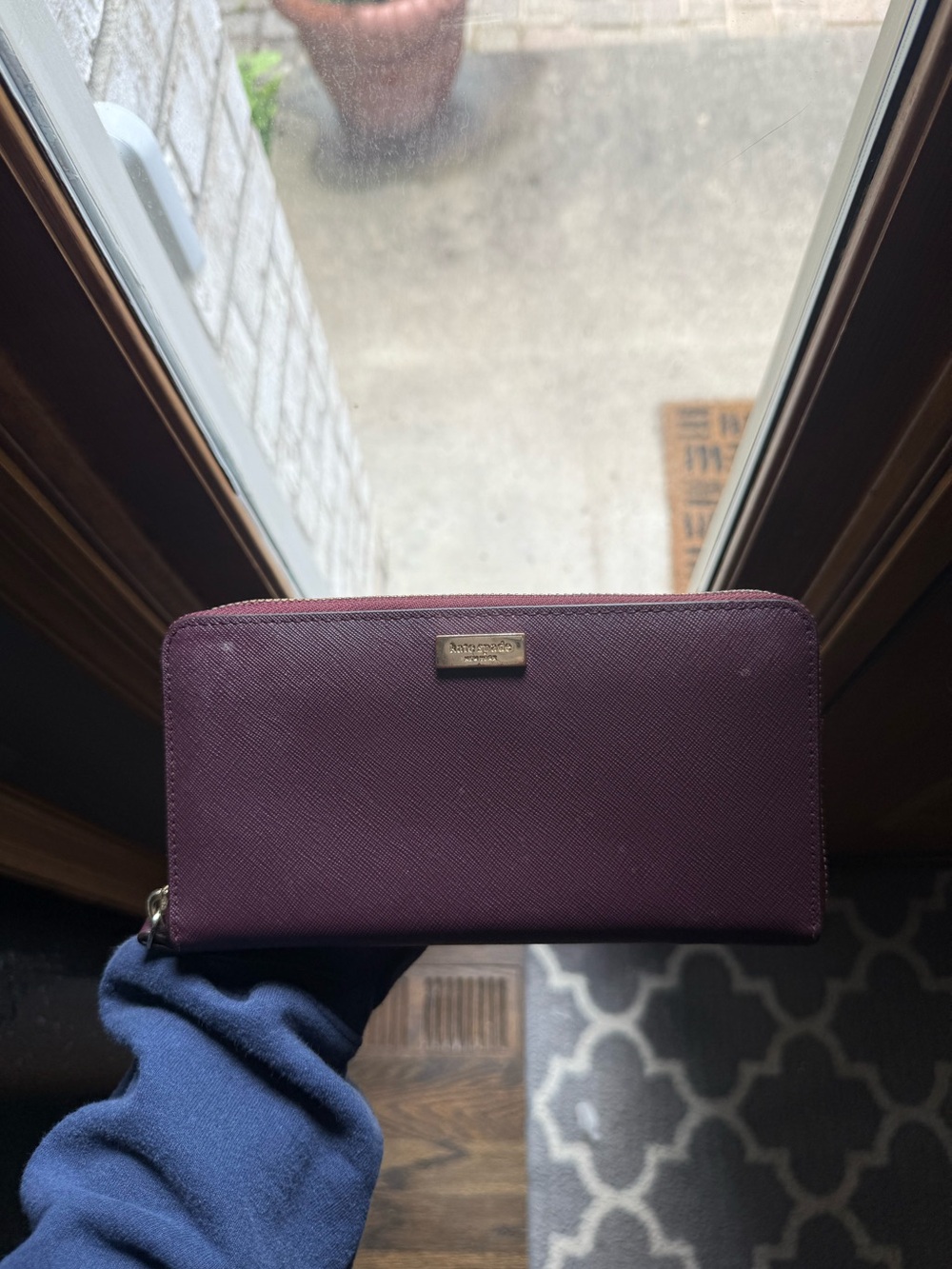kate spade plum zip-around saffiano wallet with gold logo